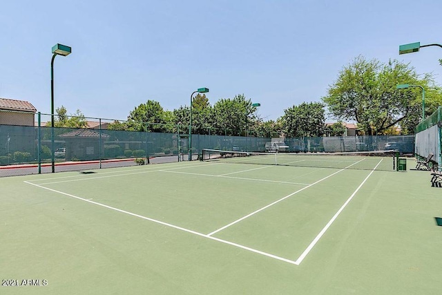 view of sport court featuring community basketball court and fence