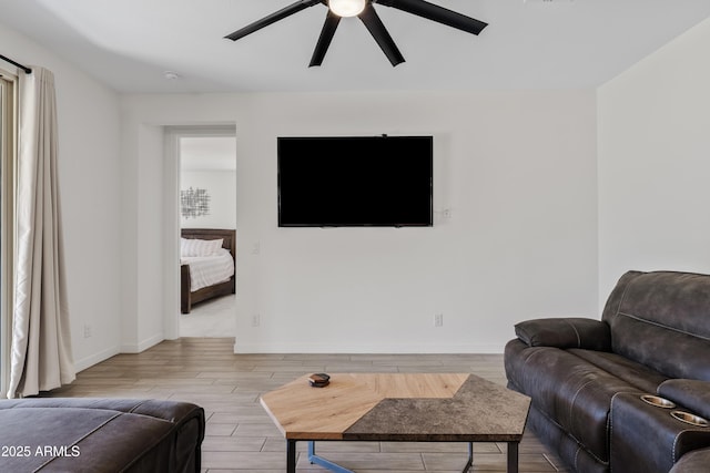 23037 E Domingo Rd, Queen Creek, AZ 85142 - living area with a ceiling fan, wood finished floors, and baseboards