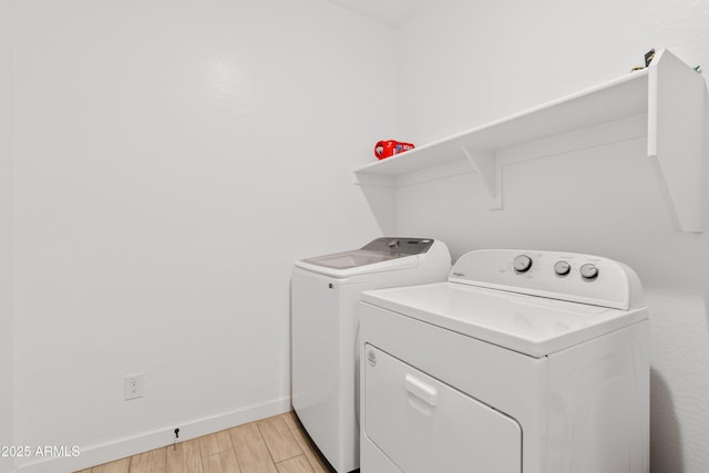 23037 E Domingo Rd, Queen Creek, AZ 85142 - washroom with washer and clothes dryer, light wood finished floors, and baseboards