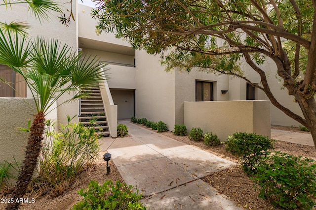 exterior space with fence and stucco siding