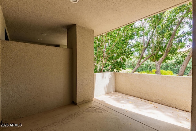 view of patio with a balcony