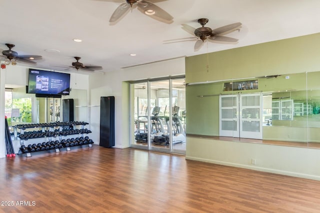 gym featuring plenty of natural light, ceiling fan, recessed lighting, and wood finished floors