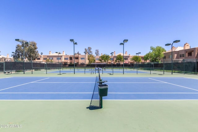 view of sport court featuring fence and community basketball court