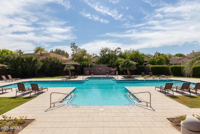 pool with fence and a patio area