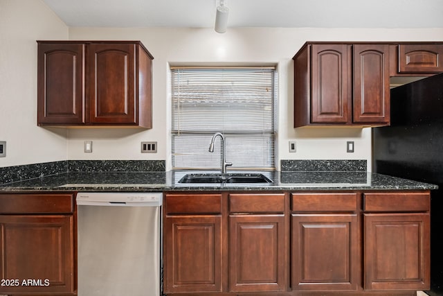 kitchen with black fridge, dark stone counters, dishwasher, and sink