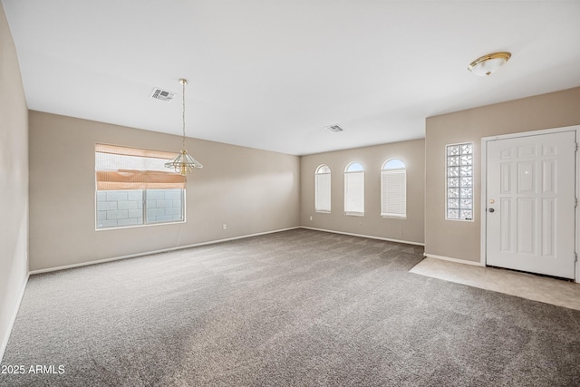 view of carpeted foyer