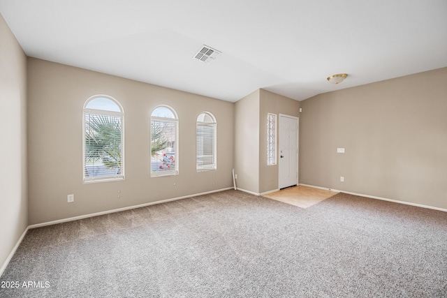 unfurnished room with light carpet