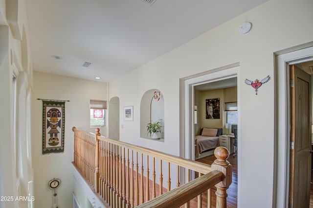 hall with wood-type flooring