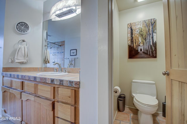 bathroom with toilet and vanity