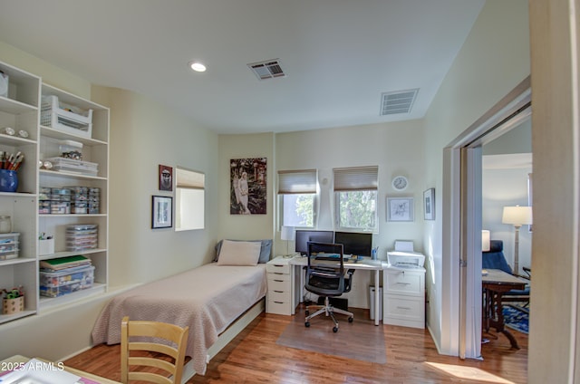 bedroom with light hardwood / wood-style flooring