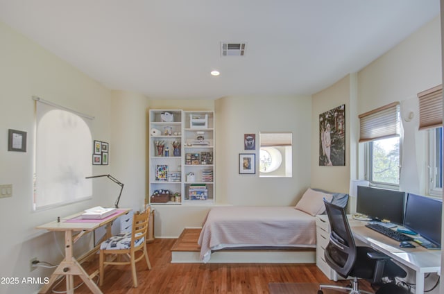 bedroom featuring hardwood / wood-style flooring