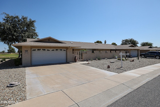 single story home featuring a garage