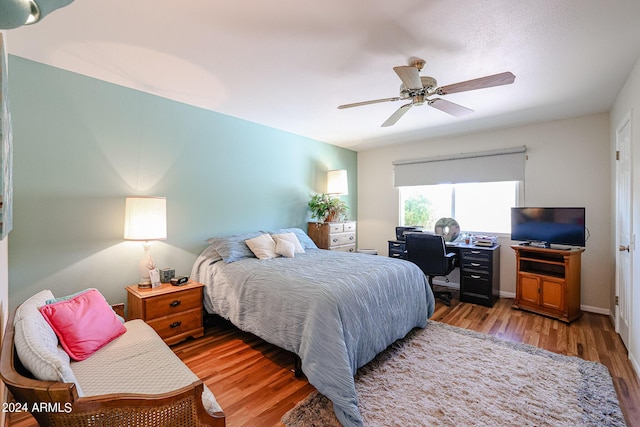 bedroom featuring ceiling fan and light hardwood / wood-style flooring