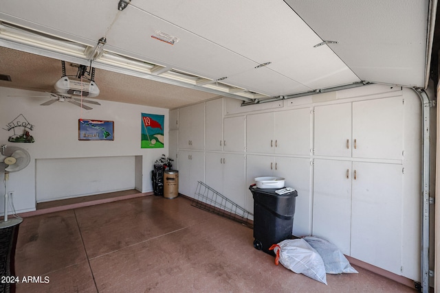 garage featuring a garage door opener and ceiling fan