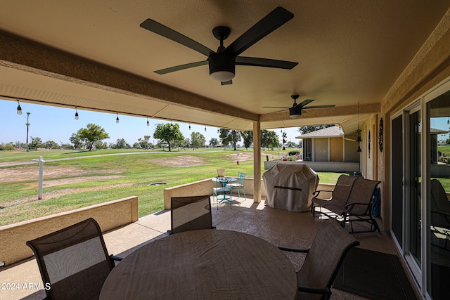 view of patio / terrace with ceiling fan and a grill