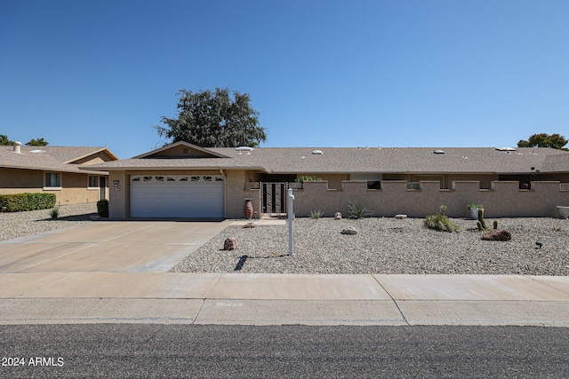 ranch-style house featuring a garage