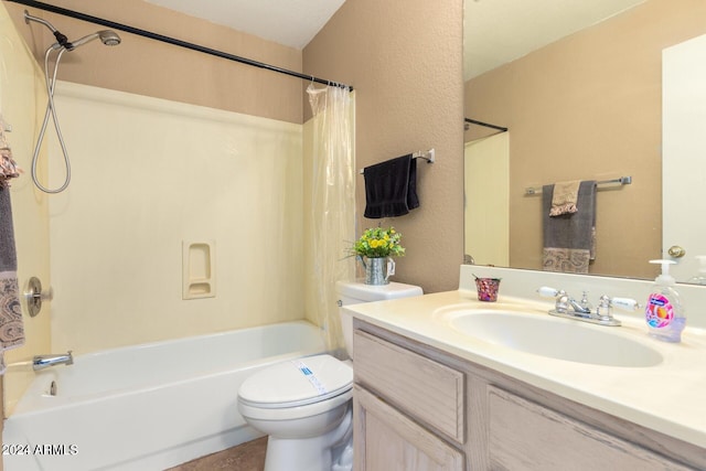 full bathroom with vanity, shower / tub combo, and toilet