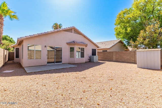 back of house featuring a patio and central AC unit