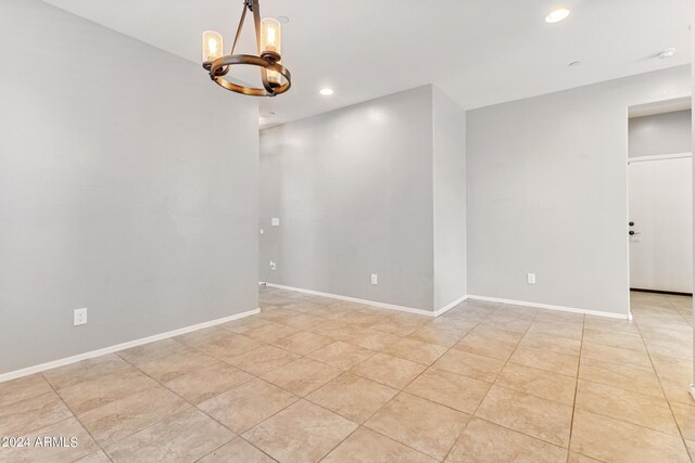 21243 W Coronado Rd, Buckeye, AZ 85396 - unfurnished room featuring baseboards, a chandelier, recessed lighting, and light tile patterned floors