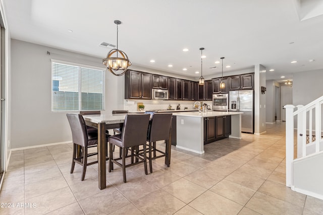 dining room featuring light tile patterned floors and an inviting chandelier