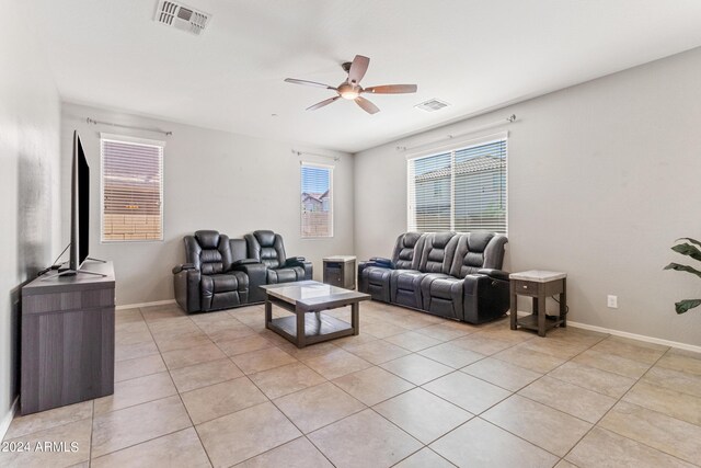 living room featuring light tile patterned floors and ceiling fan