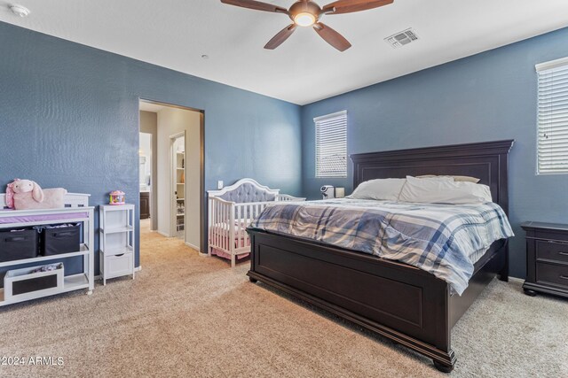 bedroom featuring ceiling fan and light colored carpet