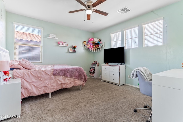 21243 W Coronado Rd, Buckeye, AZ 85396 - bedroom with ceiling fan, visible vents, multiple windows, and carpet