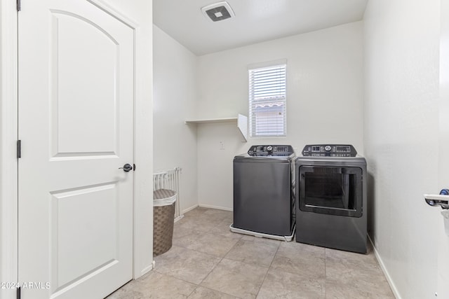 21243 W Coronado Rd, Buckeye, AZ 85396 - clothes washing area featuring visible vents, baseboards, laundry area, washer and dryer, and light tile patterned floors