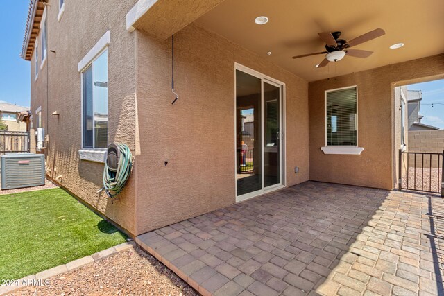 view of patio with ceiling fan and central air condition unit