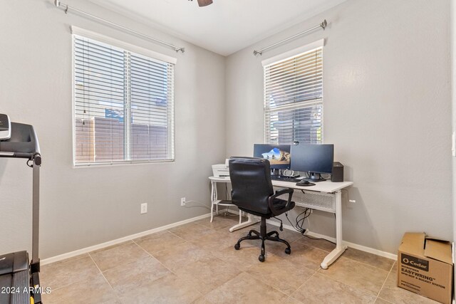 home office with a wealth of natural light and light tile patterned floors