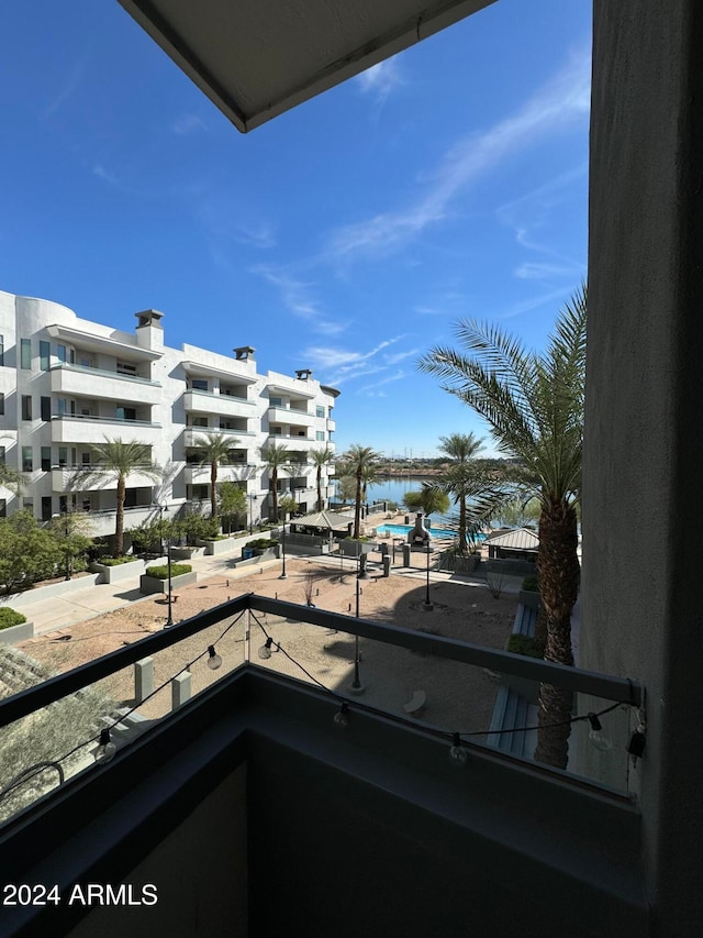 balcony featuring a water view