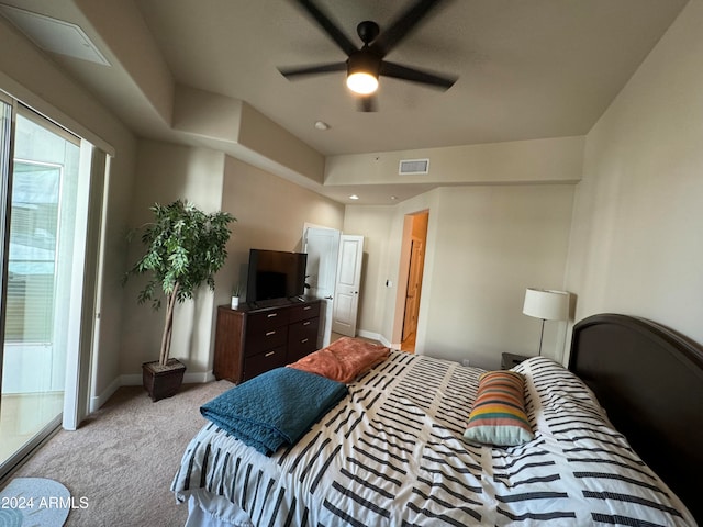 bedroom with light colored carpet and ceiling fan