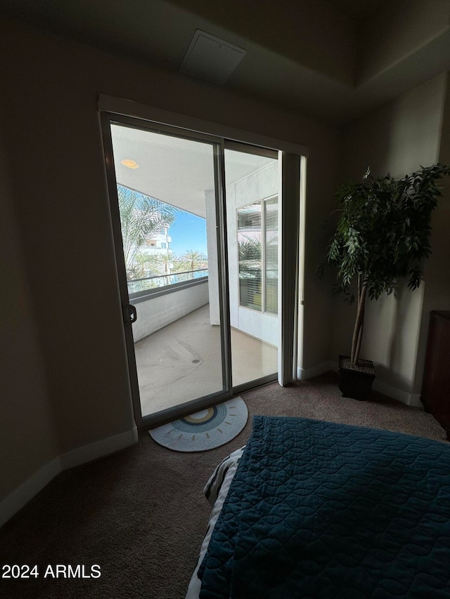 doorway with carpet flooring