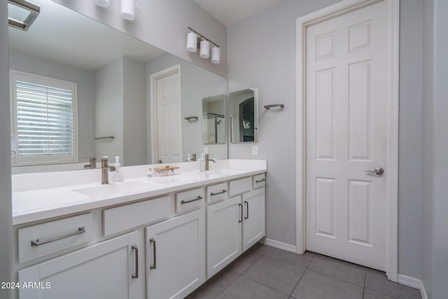 bathroom with tile patterned flooring and vanity