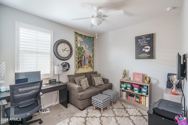 carpeted office with ceiling fan