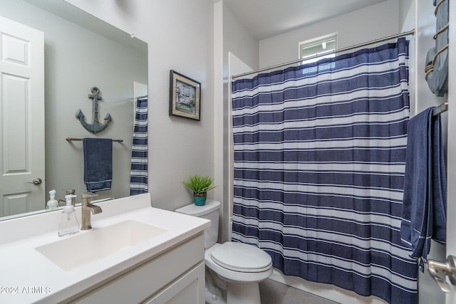 bathroom with vanity, toilet, and walk in shower