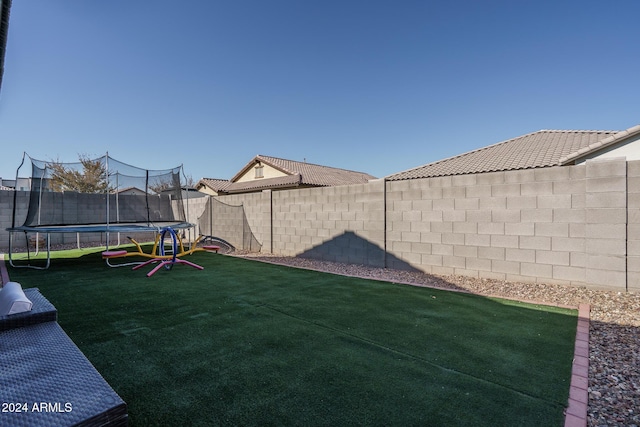 view of yard featuring a trampoline