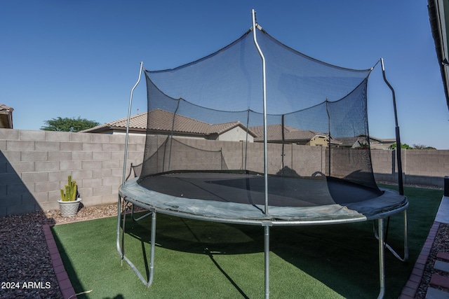 view of yard with a trampoline