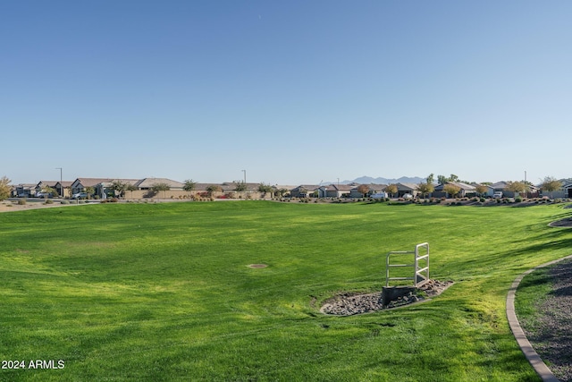 view of home's community with a yard