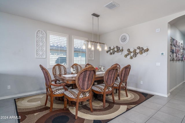 dining area featuring light tile patterned floors