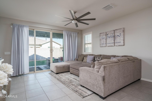 tiled living room with ceiling fan