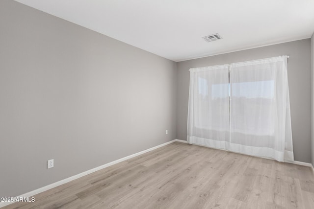 unfurnished room featuring light wood-type flooring