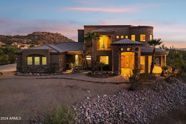 pueblo-style house with a mountain view