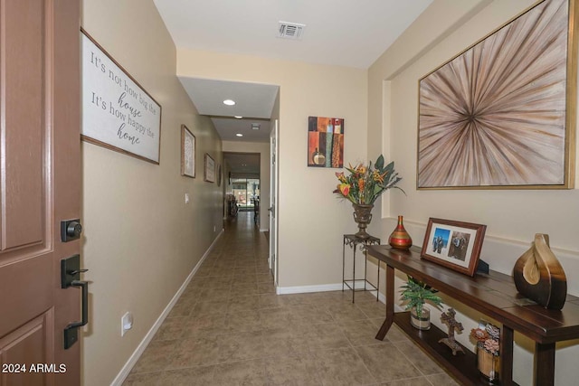 hall featuring light tile patterned flooring