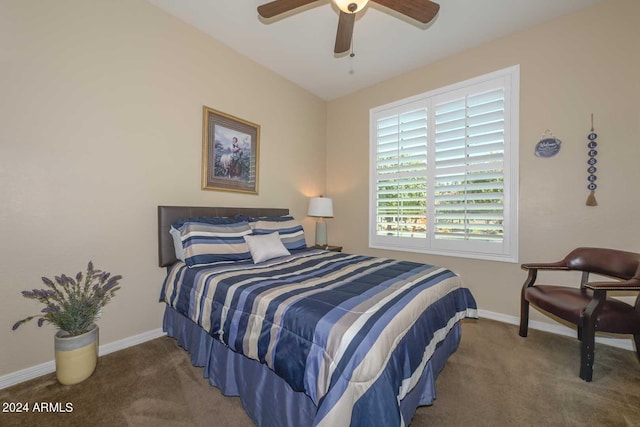 bedroom with ceiling fan and dark colored carpet