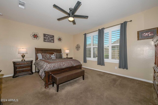 bedroom with dark carpet and ceiling fan