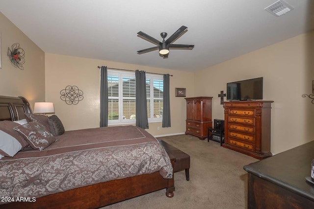 bedroom featuring light carpet and ceiling fan