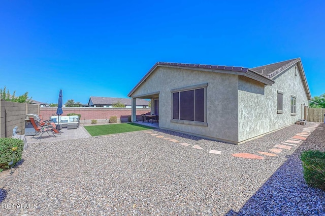 rear view of property with a patio