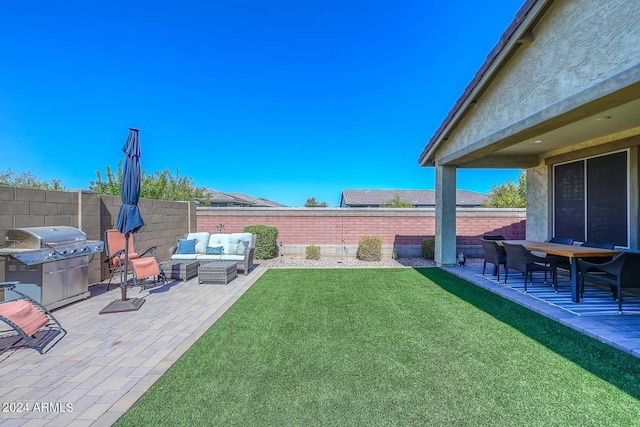 view of yard with an outdoor living space and a patio