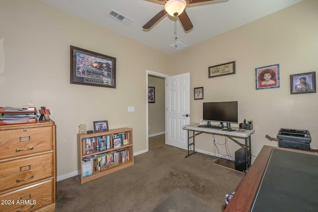 office space with dark colored carpet and ceiling fan